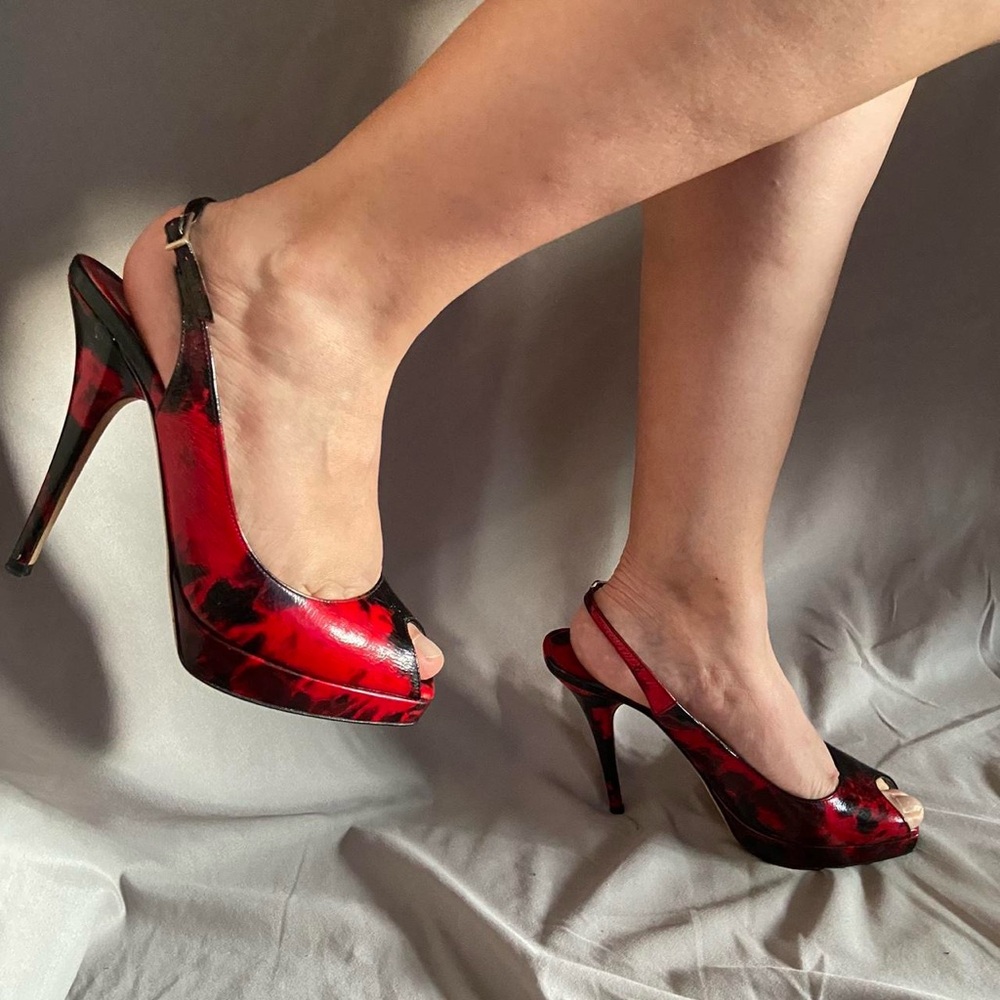 Jimmy Choo red and black pumps

To die for peek-toe pumps in the best condition